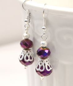 Purple Crystal Earrings, Metallic Purple & Silver Dangles, Wedding Jewelry, Royal Purple Jewelry, Holiday Gift, Bridesmaid Earrings 8mm and 10mm metallic purple crystal earrings, accented with diamond dust silver beads. Silver plated french hook ear wires. 1.5" earrings. #E739 Wanna See More? Click below for other items available: http://www.etsy.com/shop/StudioMJewelry Shipping: All jewelry pieces are ready to ship. Items are shipped to your Etsy address, via USPS First Class mail with tracking Jewelry Royal, Prom Earrings, Purple Jewelry, Purple Crystal, Royal Purple, Purple Crystals, Bridesmaid Earrings, Crystal Earrings, Silver Beads