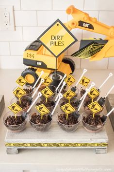 construction themed dessert table with dirt piles