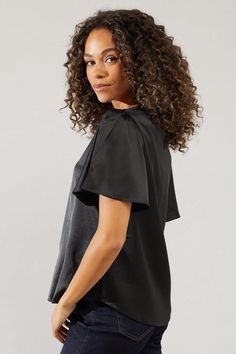 Luxurious satin fabric for a sophisticated look
Short sleeve design with subtle puff detail
Versatile crew neckline for various styling options
Relaxed fit for comfort and ease of movement
Sleek silhouette suitable for day-to-night transitions
This Wallis satin short sleeve blouse radiates effortless glamour, perfect for the woman who appreciates both style and comfort. The lustrous fabric catches the light beautifully, adding a touch of sophistication to any ensemble. Pair it with dark wash jeans and ankle boots for a chic daytime look, as seen on our model. The relaxed fit and short sleeves with subtle puff detailing make it ideal for family gatherings or casual outings. For a more polished appearance, tuck it into a pencil skirt and add a statement necklace. The versatile crew necklin Satin Short Sleeve, Work Wear Outfits, Short Sleeve Design, Look Short, Satin Short, Smart Dress, Lace Skater Dress, Trending Boots, Halterneck Dress