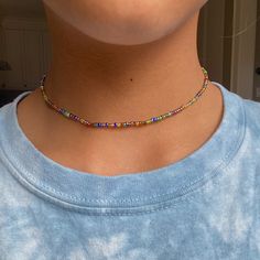 - Cute multi-colored beaded choker perfect for the summertime! A really great base accessory for layering necklaces! - Handmade item  - Metal material: Nickel Free Zinc Alloy - Made with 0.8 mm elastic cord  - 13 inches + 1 inch chain extension - I can also make it longer or shorter! - Shipping is untracked - Message me if you have any questions <3 Adjustable Multicolor Beaded Chain Choker, Adjustable Rainbow Beaded Choker Necklaces, Adjustable Multicolor Beaded Choker, Multicolor Gold Beaded Summer Jewelry, Multicolor Choker For Summer Gift, Multicolor Gold Beaded Jewelry For Summer, Multicolor Gold Beads Jewelry For Summer, Multicolor Summer Choker As Gift, Casual Multicolor Round Beads Choker