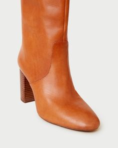 Tall shaft boot with high heel in cognac brown vachetta leather. Padded footbed with gold stamped logo. Almond toe, pulls on. 3.5 inch heel. Size (US) Shaft Height Calf Circumference 5 14.92" 14.49" 5.5 15.08" 14.67" 6 15.24" 14.84" 6.5 15.39" 15.02" 7 15.55" 15.2" 7.5 15.71" 15.37" 8 15.87" 15.55" 8.5 16.02" 15.73" 9 16.18" 15.91" 9.5 16.34" 16.11" 10 16.5" 16.26" 10.5 16.65" 16.48" 11 16.81" 16.61" 11.5 16.97" 16.8" 12 17.13" 16.97" Chestnut Color, Tall Boot, Honey Colour, Pattern Play, Recycled Rubber, New Sneakers, Sport Sandals, House Dress, 5 Inch Heels