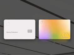 two credit cards sitting next to each other