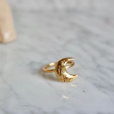 This ring is handmade by me and moulded bronze. Ring size is adjustable you can use for your every finger. Ring is 18 k gold. Crescent size is: 1.5 cm in height. Adjustable Moon Shaped Celestial Rings, Celestial Moon Phase Open Ring Jewelry, Celestial Open Ring With Moon Phase Detail, Adjustable Moon-shaped Celestial Rings, Nickel-free Celestial Moon Ring, Celestial Moon Phase Open Ring, Yellow Gold Moon Phase Ring Jewelry, Yellow Gold Moon Phase Ring, Celestial Open Ring With Moon Charm