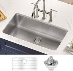 a stainless steel kitchen sink with two faucets on the side and an additional drain