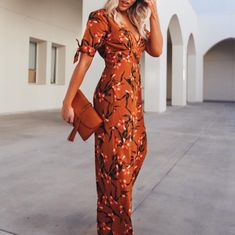 Gorgeous Floral Jumper That Is Can Be Dress Up Or Down! Features Flirty Sleeve Tie Detail, Button Front Closure, And Pockets. Spring Brown V-neck Jumpsuits And Rompers, Spring Vacation Brown Jumpsuits And Rompers, Elegant Fitted Orange Jumpsuits And Rompers, Orange Fitted Elegant Jumpsuit, Elegant Fitted Orange Jumpsuit, Chic Orange Fitted Jumpsuits And Rompers, Orange Fitted Chic Jumpsuits And Rompers, Brown Fitted V-neck Jumpsuits And Rompers, Brown Fitted V-neck Jumpsuit