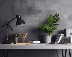 a white table topped with books and plants next to a wall mounted lamp on top of it