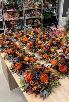 an arrangement of flowers on a table in a store