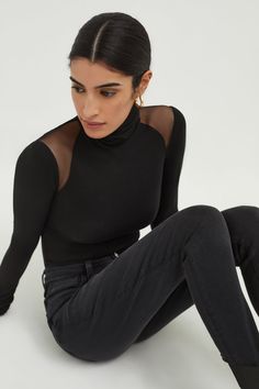 Break the mold with Maria, our turtleneck with a twist. Fashioned from a high-stretch, silky soft combination of sustainable European jersey and European mesh, she features unique symmetrical mesh panels that reveal the perfect amount of shoulder. Maria can be effortlessly dressed up or down—your choice! [SPLIT] Sam, in black, is 5'8" (173 cm) tall, wearing size XS. Steph, in off white, is 5'11" (180 cm) tall, wearing size XS. Total length approximately 28" (70 cm). Sustainable European Jersey ( Elegant High Neck Mesh Top For Layering, Black Turtleneck Top With Sheer Sleeves, Fall Turtleneck Mesh Top For Layering, Stretch Mock Neck Top For Night Out, Black Turtleneck Mesh Top With Sheer Sleeves, Fall Layering Turtleneck Mesh Top, Elegant Top With Mesh Sleeves For Winter, High Neck Mesh Top For Fall Layering, High Neck Mesh Top For Layering In Fall