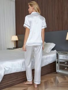 Indulge in pure comfort with our Embroidery Letter Contrast Binding Satin Pajama Set. Experience relaxation in style with its casual-comfy design, complete with charming embroidered details, contrast binding, and a button-front collar. Crafted from luxurious satin, this 2-piece set features a loose fit and convenient pocket. Elevate your loungewear game with elegance. Easy care in machine wash. Specifications: Style: Casual-Comfy Pattern Type: Letter Type: Pant Sets Neckline: Collar Details: Emb Solid Color Home Sets, Comfortable White Home Wear Set, White Short Sleeve Sets For Home, White Short Sleeve Home Sets, White V-neck Bedtime Set, Elegant Short Sleeve Loungewear Sets, Blouse And Pants Set, Bride Pajama, Blouse And Pants