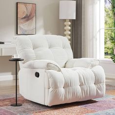 a white recliner sitting on top of a rug in a living room