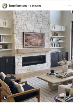 a living room filled with furniture and a fire place in the middle of a room