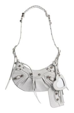 Balenciaga reimagines an archived style with this hemispherical shoulder bag crafted from supple leather and detailed with sparkling rhinestones. A tasseled zipper pull, heart-shaped mirror bag charm and zip pouch complete the look with signature flair. Top zip closure Adjustable shoulder strap Removable mirror and zip pouch Lined Leather Made in Italy Designer Handbags Silver Leather Shoulder Bag As Fashion Accessory, Silver Leather Bags For Fashion, Woman Bags Handbags, Zip Pouch, Leather Shoulder Bag, Bags Handbags, Balenciaga, Shoulder Strap, Heart Shapes