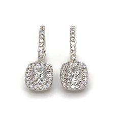 Perfect match, our 1.35ct tw diamond drop earrings are timeless and sure to please for everyday wear.Metal: 18K White GoldDiamond Shape: 2 Siganature Daussi Cushion Brilliant-cutsDiamond Weight & Details: 0.88ct tw - F color / VS2 ClarityPave Diamonds: 82 Round Brilliant Cuts 0.47ct twBackings: Lever Backs Certificate: Henri Daussi Cushion Cut With Halo, Henri Daussi, Diamond Drops, Diamond Drop Earrings, Round Brilliant Cut, Cushion Cut, Brilliant Cut Diamond, Halo Diamond, Pave Diamonds