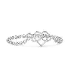 The infinity symbol, entwined with an open heart frame, is metaphorically used with respect to love. This beautiful chain bracelet, crafted in 14k white gold, signifies limitless love. Elegant White Gold Friendship Bracelets, Elegant Double Heart Sterling Silver Bracelet, Elegant White Gold Chain Bracelet For Valentine's Day, Elegant Double Heart Friendship Bracelets, Elegant Double Heart Friendship Bracelet, Elegant Double Heart Bracelet For Friendship, Elegant Heart Bracelet For Mother's Day Promise, Elegant Sterling Silver Chain Bracelet For Friendship, Infinity Heart Bracelet For Anniversary