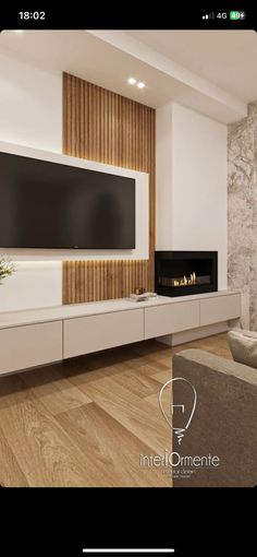 a large flat screen tv mounted to the side of a wall in a living room