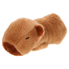 a brown teddy bear laying on its side