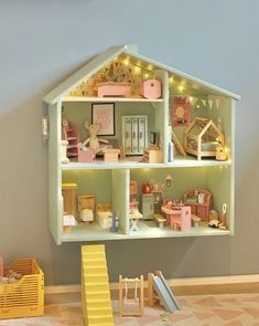 a doll house with furniture and accessories inside