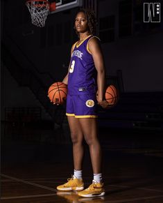 a female basketball player is posing for a photo