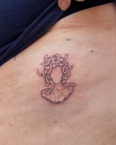 a woman with a tattoo on her stomach