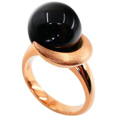 Here is a beautiful Onyx ring. It may look simple but the fact is that it is very very difficult to make because of the curve lines. The ring is set in 18k rose gold. The Onyx is 12mm in size and round. The combination of black and rose gold color is exceptional. The lines of this ring are special. One can look at this ring over and over again. It is very eye pleasing. This will be a great gift for that special someone. Please refer to the many high definition photos for more details. We can als Modern Rose Gold Dome Ring With Polished Finish, Sleek Round Rings For Gifts, Modern Rose Gold Rings With Polished Finish, Modern Oval Rose Gold Rings, Modern Rose Gold Open Dome Ring, Modern Rose Gold Round Ring, Modern Rose Gold Oval Rings, Luxury Rose Gold Dome Ring With Polished Finish, Elegant Black Dome Ring With Polished Finish