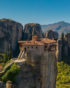 an old building perched on top of a cliff