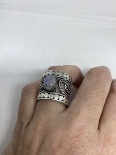 Large Vintage ring set with huge Rainbow Moonstone. Low content silver not sterling About an in long Size 8 can be resized at my jeweler for a $10-$20 fee All rings are shipped free in the US in a nice gift box. Check out our over a THOUSAND great reviews Engraving is $4 per letter and is not always perfect depending on the piece. It can take a few days if the jeweler is busy. This is payable to Paypal Judithsltd@gmail.com White Rainbow, Rainbow Moonstone Ring, Ring Vintage, White Band, Ring Photos, Moonstone Ring, Rainbow Moonstone, Cocktail Rings, 925 Sterling Silver Ring