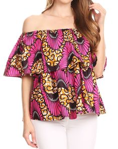 One size regular: Bust 50" (127 cm), Waist 86" ( 218 cm), Length 23" ( 48 cm). US 8-22W, EU 38-52, UK 12-26. Shell: Colorful wax Ankara print on rayon fabric. Care: Wash cold, iron from reverse to preserve vibrant color. Lovely off-shoulder ruffle top. Simple and feminine, this top has the perfect shape for many body types. Can be use on/off shoulder. Comes in unique vibrant colors. A must in any wardrobe. Versatile top that goes great with solid bottoms. Pair it with shorts and sandals for an e Bohemian Multicolor Off-shoulder Tops, Printed Off-shoulder Blouse For Vacation, Bohemian Off-shoulder Multicolor Tops, Multicolor Off-shoulder Bohemian Tops, Off-shoulder Printed Blouse For Vacation, Cotton Off-shoulder Top With Floral Print, Cotton Floral Print Off-shoulder Tops, One Shoulder Blouse For Vacation, Fitted Multicolor One Shoulder Top