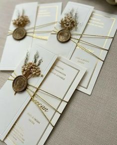 the wedding stationery is laid out on top of each other