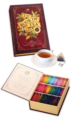 the book of tea and its contents are shown in an open box with colored pencils