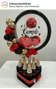 a bunch of balloons that are on top of a bottle stand with bottles in it