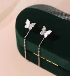 Elevate your everyday look with our lightweight & nickel-free earrings handmade with 925 Sterling Silver. They are so comfortable and petite that you won't even know that they are there. Butterfly dotted with shimmering zirconia gems & Feminine design Lightweight & Hypoallergenic Artistically handmade in 925 Sterling Silver Trendy Diamond Jewelry For Gifts, Trendy Everyday Cubic Zirconia Earrings, Trendy Gift Jewelry In Cubic Zirconia, Silver Tarnish-resistant Diamond Drop Earrings, Silver Tarnish-resistant Drop Diamond Earrings, Trendy Cubic Zirconia Pierced Earrings, Trendy Cubic Zirconia Drop Earrings, Trendy Single Cubic Zirconia Earring, Trendy Tarnish Resistant White Gold Earrings