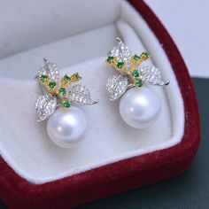 Our 11-12mm Freshwater Pearl & Color Floral Earrings are the perfect way to show off your unique style. The glimmering pearls and vibrant flower design will instantly add charm to any look. Exuding elegance, these earrings are perfect for any occasion, formal or casual. Crafted by House of Pearls, these earrings are sure to become your favorite go-to accessory. Make a timeless statement with every wear and step out with confidence! Pearl size:Earrings: 11-12mm This popular earrings design featur Elegant Green Flower Earrings For Formal Occasions, Elegant Green Round Flower Earrings, Elegant Green Flower Earrings, Elegant Green Pearl Charm Earrings, Elegant Green Pearl Earrings With Charm, Elegant Sterling Silver Pearl Earrings In Flower Shape, Elegant Flower-shaped Sterling Silver Pearl Earrings, Elegant White Round Flower Earrings, Elegant White Floral Earrings