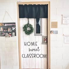 a door decorated with wreaths and some writing on it that says home sweet classroom