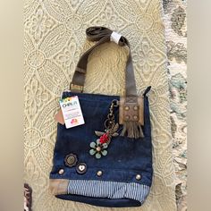 Chala Denim Crossbody Handbag. Nwt. Smoke Free And Pet Free Home! Includes The Dragonfly And Flowers Keychain. This Purse Allows You To Change The Keychain To Fit Your Style! Casual Bags With Adjustable Strap In Dark Wash, Casual Everyday Upcycled Bags, Casual Upcycled Shoulder Bag For Daily Use, Medium Wash Bag For Everyday Use In Spring, Bohemian Denim Shoulder Bag For Everyday Use, Spring Denim Crossbody Bag, Boho Purses And Bags Denim, Cheap Denim Shoulder Bag With Cell Phone Pocket, Casual Dark Wash Bag With Adjustable Strap