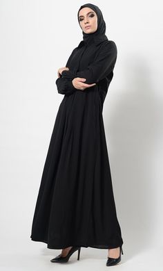 Featuring a casual everyday shirt style abaya dress in nida base with hidden overlapping button closure placket at the centre front. Its a simple muslimah abaya with bishop style sleeves and A line silhouette perfect to be worn daily for informal ocassions.FIT : Relaxed fit.COMPOSITION : Nida.CARE : Dry clean only. Long Sleeve Modest Abaya With Modesty Panel, Modest Long Sleeve Abaya With Modesty Panel, Solid Long Sleeve Maxi Dress For Eid, Modest Long Sleeve Thobe For Eid, Modest Long Sleeve Thobe With Modesty Panel, Casual Long Sleeve Abaya For Eid, Solid Color Abaya With Modesty Panel For Eid, Eid Abaya With Modesty Panel In Solid Color, Modest Abaya With Modesty Panel