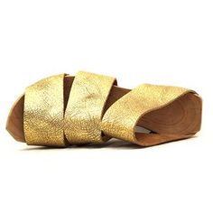 Tire-W - Cydwoq Modern Gold Wedge Sandals For Spring, Gold Leather Mules For Spring, Gold Leather Open Heel Mules, Spring Gold Sandals With Leather Footbed, Gold Mules With Leather Sole For Summer, Gold Leather Sandals With Leather Footbed, Spring Gold Leather Wedge Sandals, Casual Gold Leather Mules, Gold Leather Sandals With Wooden Heel