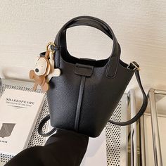 Color: Black Trendy Black Crossbody Bucket Bag, Black Satchel Mobile Phone Bag, Black Bucket Shoulder Bag With Phone Pocket, Black Satchel With Mobile Phone Bag, Black Handheld Shoulder Bag For Shopping, Trendy Black Shoulder Bag For Office, Black Mobile Phone Bag With Double Handle, Black Double Handle Mobile Phone Bag, Black Bucket Bag With Removable Pouch