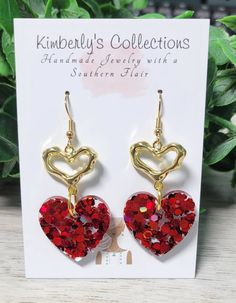 Red glitter dangle heart earrings. Made with lead and nickle free posts. Perfect Valentine's Day gift or accessory. Hang down about 1.5in from ear Will come gift-wrapped. Ships free. Multiple colors available. Valentine's Day Heart Earrings Gift For Her, Heart-shaped Earrings For Mother's Day Party, Mother's Day Heart Earrings For Party, Nickel-free Heart Drop Earrings For Party, Handmade Heart Earrings For Valentine's Day Party, Drop Earrings Jewelry Gift For Valentine's Day, Personalized Heart Earrings For Party, Personalized Earrings For Valentine's Day Party, Red Glitter Jewelry For Party