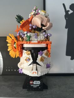 a lego star wars trooper with flowers on his head