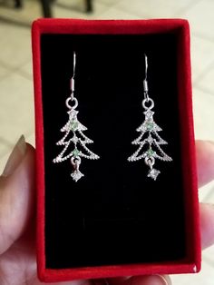 New Handmade  Stunning Sterling Silver Christmas Tree Earrings No forests were harmed in the making of these gorgeous crystal Christmas Tree earrings. These beautiful Christmas classics will add instant festive charm to your look ♡ Christmas tree earrings are adorned with delicate alternating green and white crystals, with a dangling white crystal at the bottom ♡ .925 Sterling silver ♡ Measure 1.5 inches long ♡ Hypoallergenic (nickel free) ♡ Ships with a gift box ♡ Also available in 14k gold pla Crystal Christmas Tree, Silver Christmas Tree, Christmas Tree Earrings, White Crystals, Earring Tree, Silver Christmas, White Crystal, Christmas Earrings, Christmas Jewelry