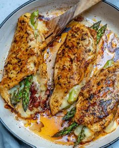 picking up chicken with a wooden spoon Asparagus Stuffed Chicken, Asparagus Stuffed Chicken Breast, Fitness Meals, Stuffed Chicken Breast, Healthy Fitness Meals, Chicken Asparagus, Breast Recipe, Stuffed Chicken, Asparagus Recipe