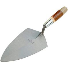 a large knife with a wooden handle on it's tip is shown in front of a white background