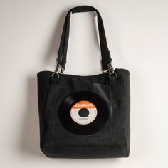 "Personalize this Tote Bag daily by changing out with a vintage vinyl  45 record display vibe!  Exterior is constructed of tightly woven hemp/cotton blended natural fiber fabric in black. Has 2 exterior pockets; one of the same black hemp blended 8\"x8\" square with zippered top and wood-beaded cascading pull, and opposite a clear vinyl square open-top to slide in your own fav 45.   lnterior is lined with heavy nylon poly in charcoal, easily wipe-able and practical. Two interior pockets made with vintage cotton repurposed men's shirting in rasta, island colors;  one is 7.5 x8\" zippered, nice for secure inside storage of a smartphone. Longer (24\") pair of strapped handles have an extra leather wrapping mid section for longer wear. Heavy-duty, black-anodized-finish swivel hooks on D-rings Retro Black Canvas Bag For Travel, Black Retro Canvas Bag For Travel, Retro Black Canvas Travel Bag, Retro Black Canvas Bag For Daily Use, Vintage Black Canvas Bag For Daily Use, Record Bag, Record Display, 45 Records, Bag Display