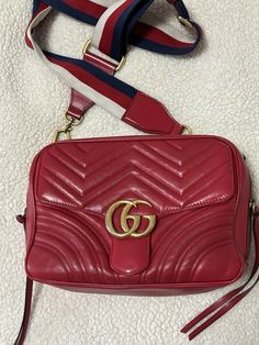 This authentic Gucci bag is in good preowned condition it is used so it has a slight used feel to it, the interior has a stain and the hardware has tarnished please see pics for condition. Gucci Red Marmont Bag, Red Quilts, Small Shoulder Bag, Quilted Leather, Gucci Bag, Stain, Gucci, Shoulder Bag, Best Deals