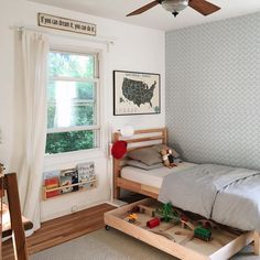 a child's bedroom with a bed and toys