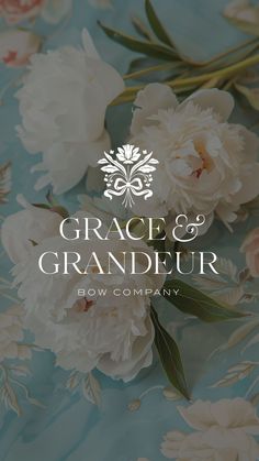 the logo for grace and grandeur bow company, with white flowers on a blue background