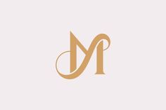 the letter m is made up of two letters, one in gold and the other in brown