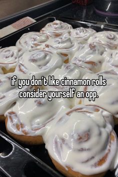 a bunch of cinnamon rolls sitting on top of a baking pan with the words if you don't like cinnamon rolls consider yourself an app