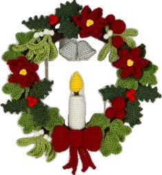 a crocheted wreath with a lit candle in the center and poinsettis around it