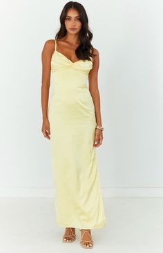 Yellow Maxi Dress  The perfect maxi dress for your next formal or cocktail event. Elegant, stunning and chic - pair with nude heels to complete this gorgeous outfit!   Maxi length  Adjustable spaghetti straps  Satin-like material  Invisible zip up centre back Gathered bust Lined  Light-weight material with no stretch  Side leg split Yellow Prom Dress Pale Skin, Light Yellow Satin Prom Dress, Yellow Silk Wedding Maxi Dress, Pale Yellow Maxi Dress, Low Back Satin Maxi Dress Pale Yellow, Pale Yellow Dress, Preference Night, Yellow Satin Dress, Silk Yellow Dress